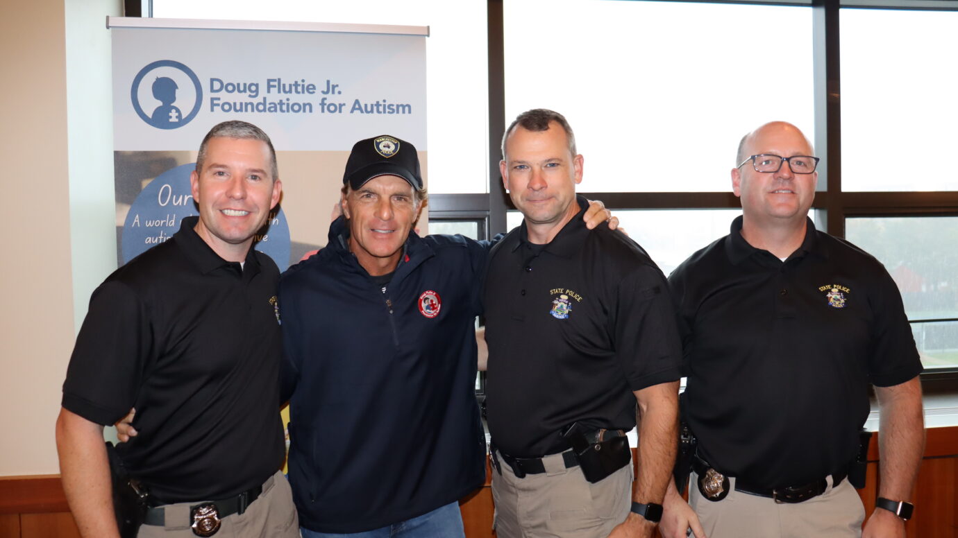 Flutie with cops at an event