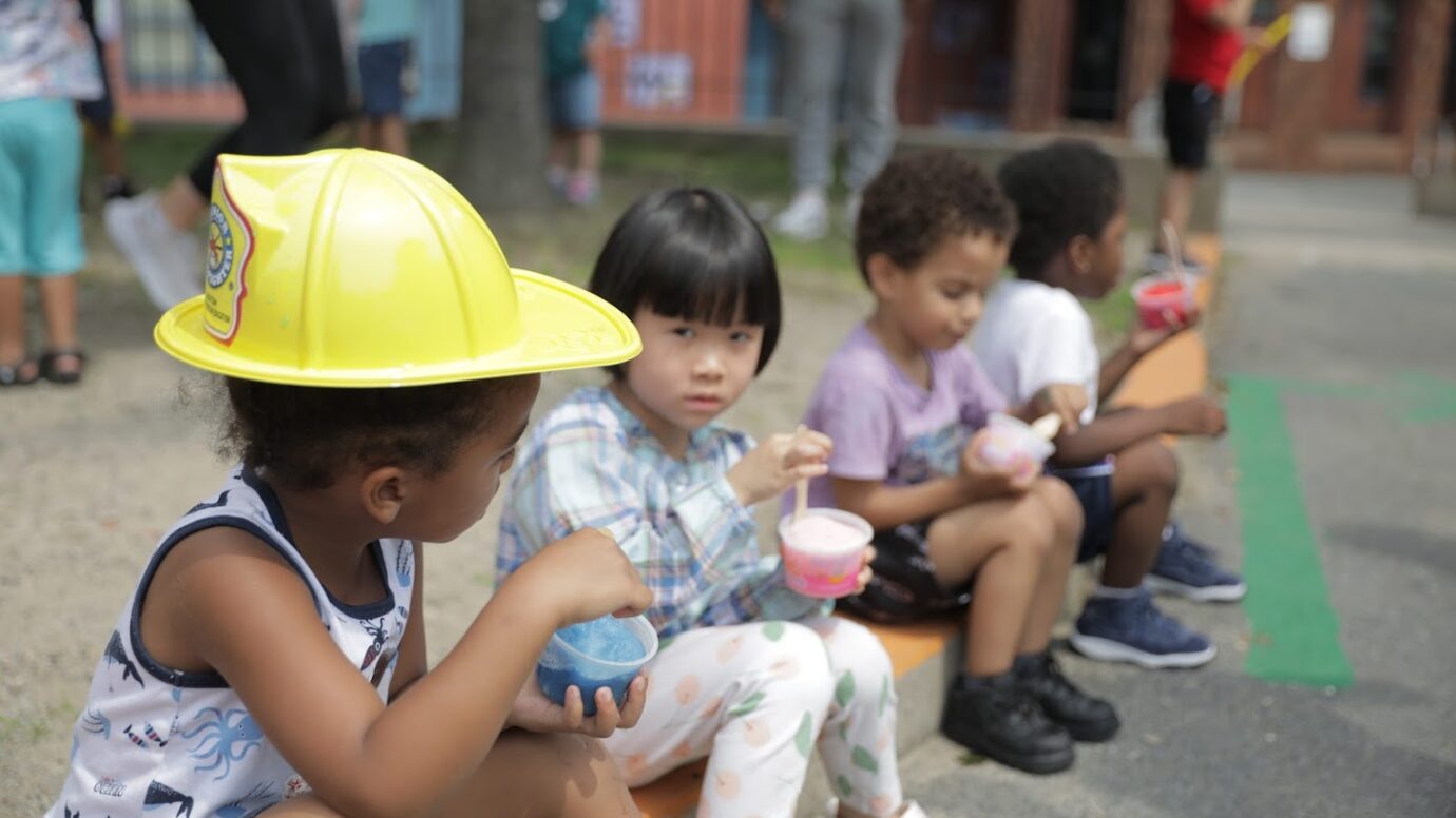 Kids eating frozen treats at a fundraiser event